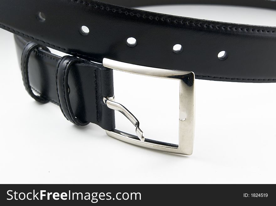 Black leather belt with buckle unfastened on white background. Black leather belt with buckle unfastened on white background