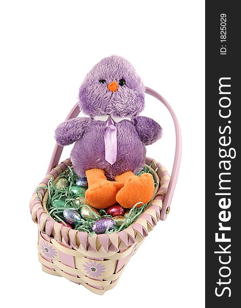 An adorable stuffed chickadee in an easter basket, surrounded by milk chocolate eggs.  Isolated on white. An adorable stuffed chickadee in an easter basket, surrounded by milk chocolate eggs.  Isolated on white.