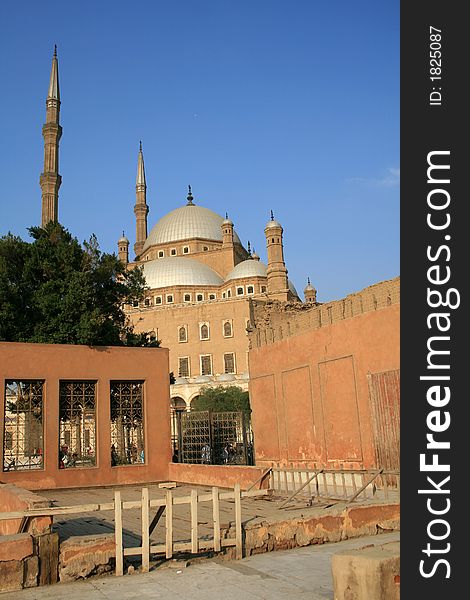 A deeper view of the Sultan Hussein mosque at Cairo Citadel in Egypt. Shot taken from the entrance to the Jewel palace. Blue sky in the background. A deeper view of the Sultan Hussein mosque at Cairo Citadel in Egypt. Shot taken from the entrance to the Jewel palace. Blue sky in the background.