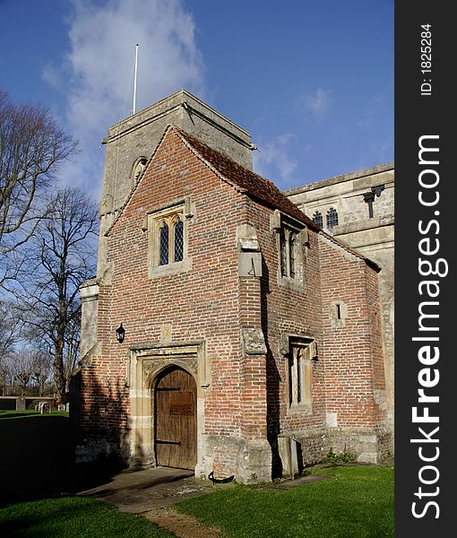 Ancient English Church and Graveyard with Medieval entrance building. Ancient English Church and Graveyard with Medieval entrance building