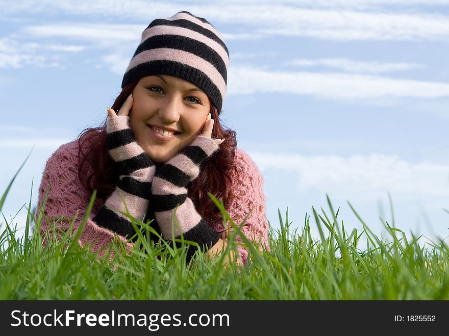 Happy smiling girl, laying grass