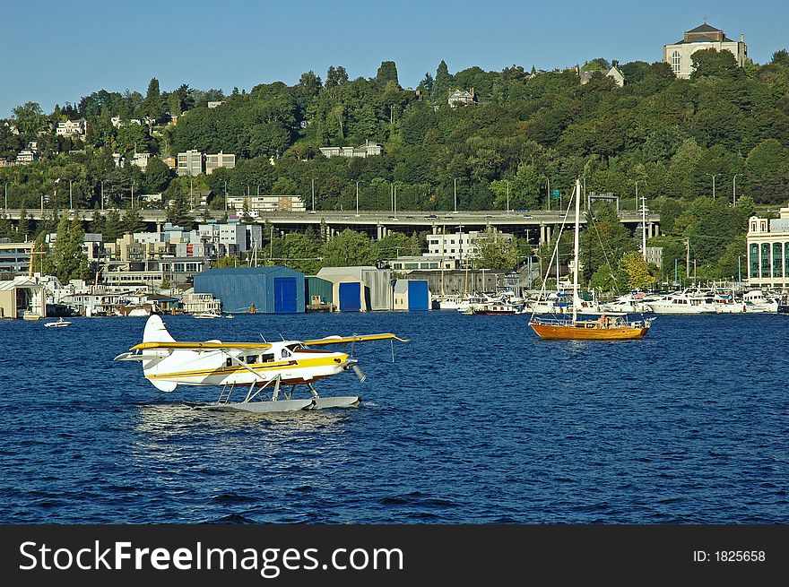 Seaplane and wooden sailboat on Lake Union in Seattle, WA. Seaplane and wooden sailboat on Lake Union in Seattle, WA