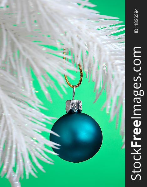 Blue Christmas Ornament hanging on a tree branch. Blue Christmas Ornament hanging on a tree branch.