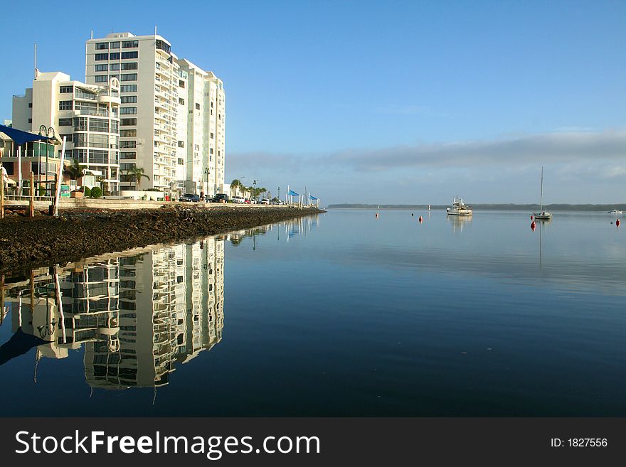 Holiday apartment tower waterside in the early morning. Holiday apartment tower waterside in the early morning.