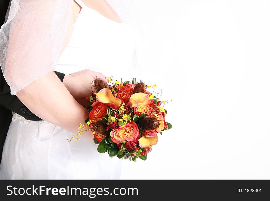 A loving embrace of a bride and groom