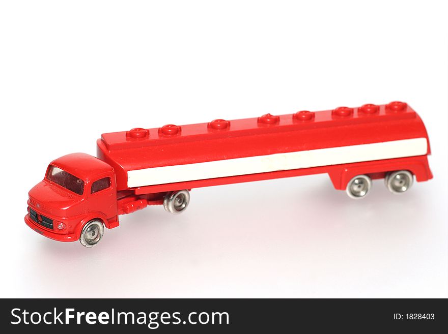 Red old plastic toy tank lorry