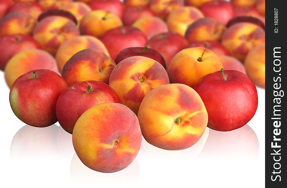 Peaches and red apples on light background