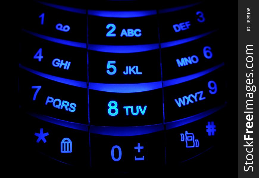Cellular phone keyboard blue in the night