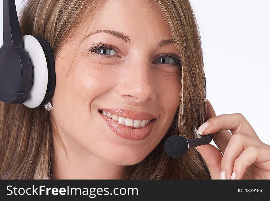 Smiling female operator with headset looking at the camera. Smiling female operator with headset looking at the camera