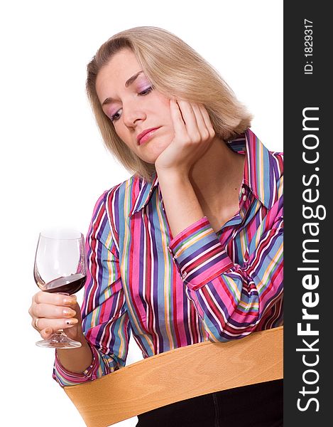 Picture of a sad blond girl with a glass of red wine. Picture of a sad blond girl with a glass of red wine