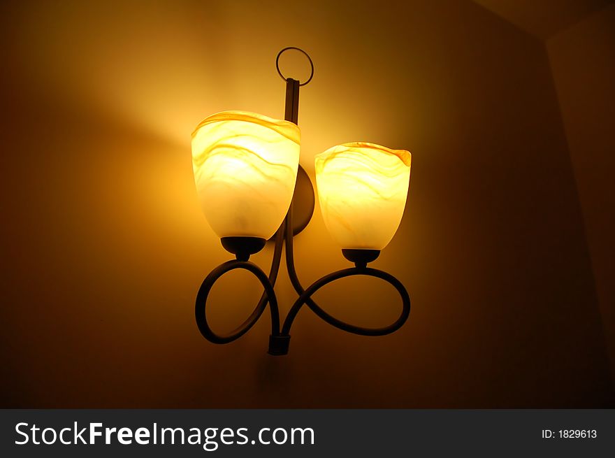 Vintage lamp on wall; atmosperic interior shot