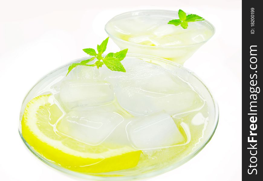 Alcohol yellow liqueur cocktail with ice and lemon. Alcohol yellow liqueur cocktail with ice and lemon