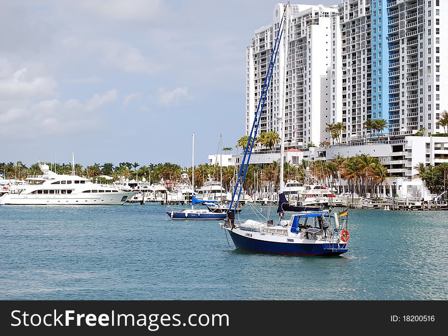 Sailboat at anchor at a condo marina in the southbeach section of Miami Beach. Sailboat at anchor at a condo marina in the southbeach section of Miami Beach