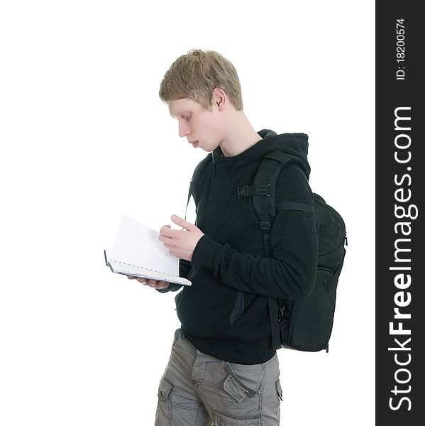 Male student reading some notebooks - isolated over a white background. Male student reading some notebooks - isolated over a white background