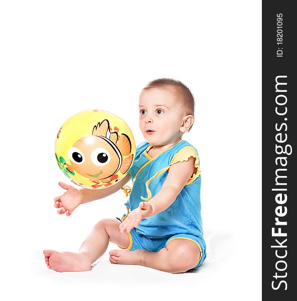 Baby boy with ball on a white background