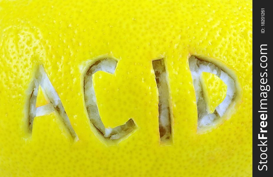 Inscription acid on lemon surface