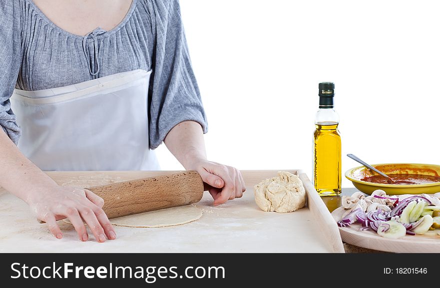 Hands roll out dough on kitchen countertop. Hands roll out dough on kitchen countertop
