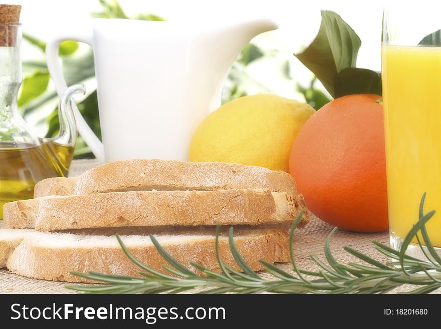 Tipical mediterranean breakfast with fruits, juice, bread and olive oil. Tipical mediterranean breakfast with fruits, juice, bread and olive oil