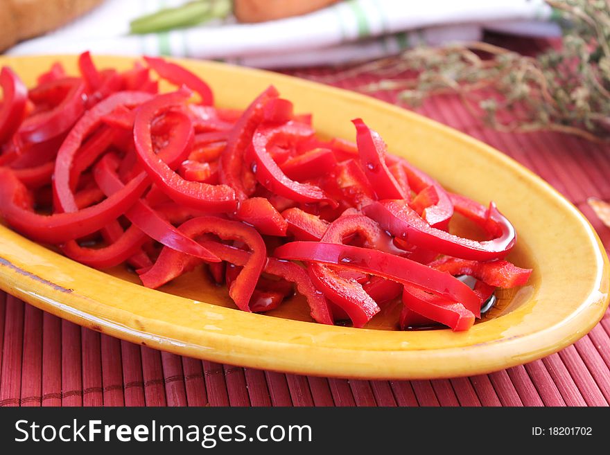 Salad of red bell pepper on a plate