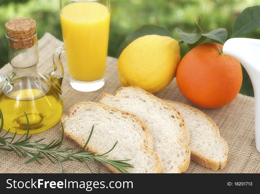 Tipical mediterranean breakfast with fruits, juice, bread and olive oil. Tipical mediterranean breakfast with fruits, juice, bread and olive oil