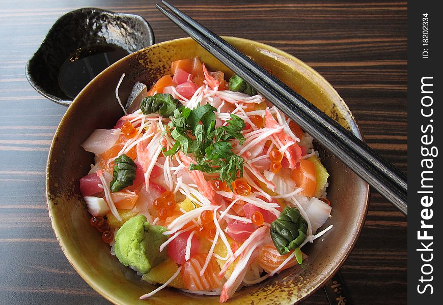 A bowl of Japanese sashimi with rice. A bowl of Japanese sashimi with rice.