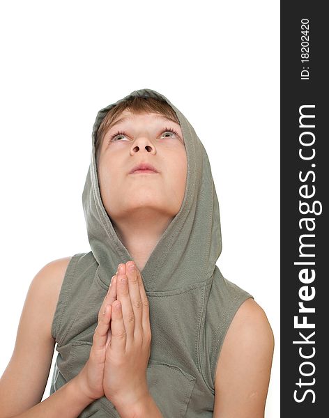 Teen prays to God. Isolated on white background.