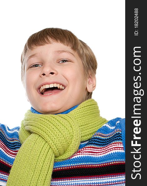 Portrait of a smiling teenager is isolated on a white background.