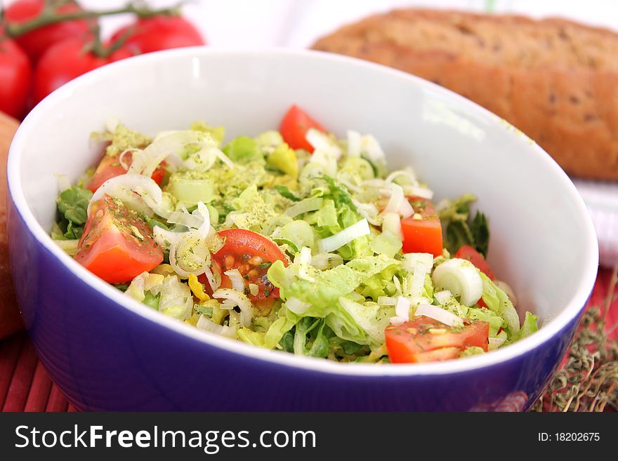 Fresh salad with tomatoes in a bowl
