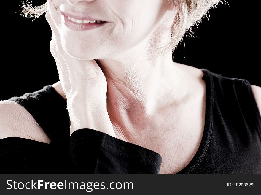 Close-up of a mature actress, black background. Close-up of a mature actress, black background