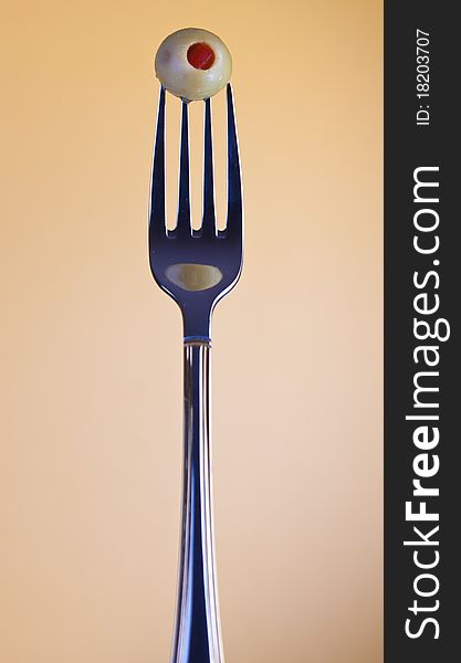 Olive on fork