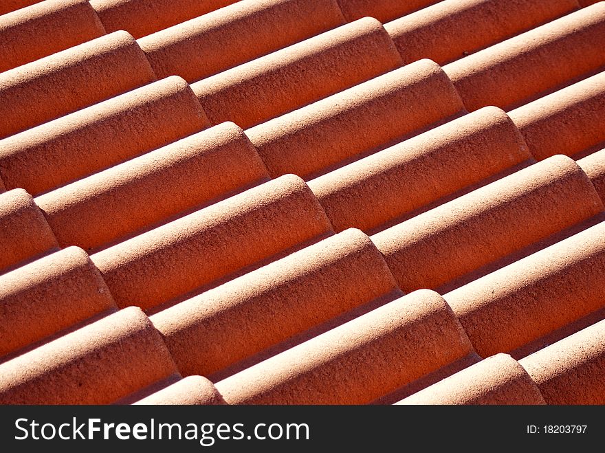 Red roof tiles pattern photo.