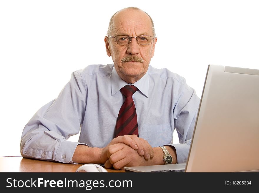 Businessman at the computer isolated on white background