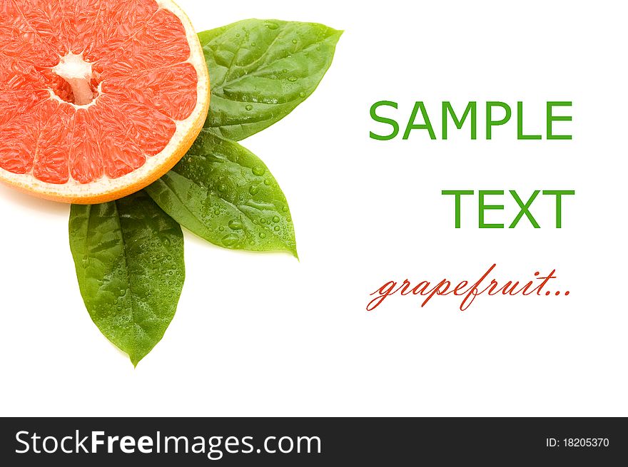 Fresh juicy grapefruits with green leafs. Isolated