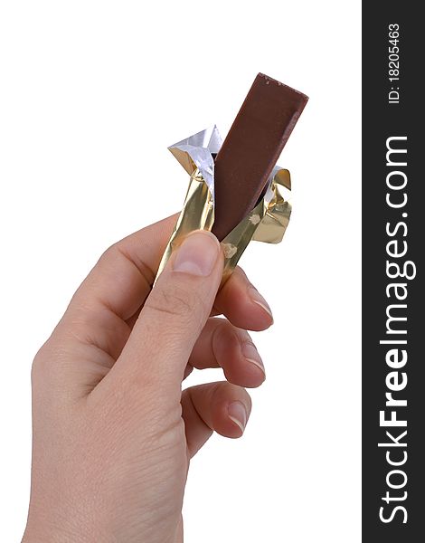 Hand holding chocolate isolated on white