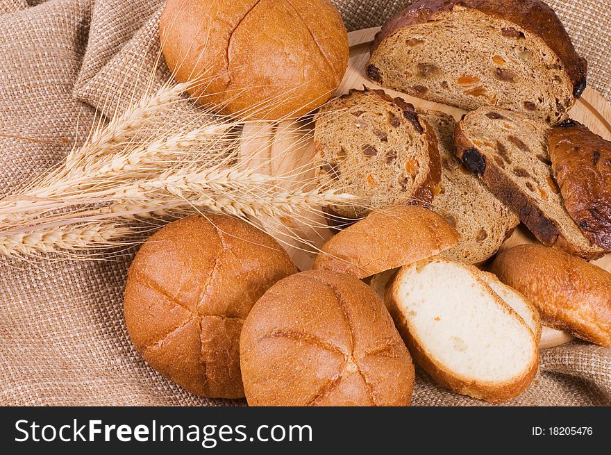 Fresh bread with ear of wheat still life