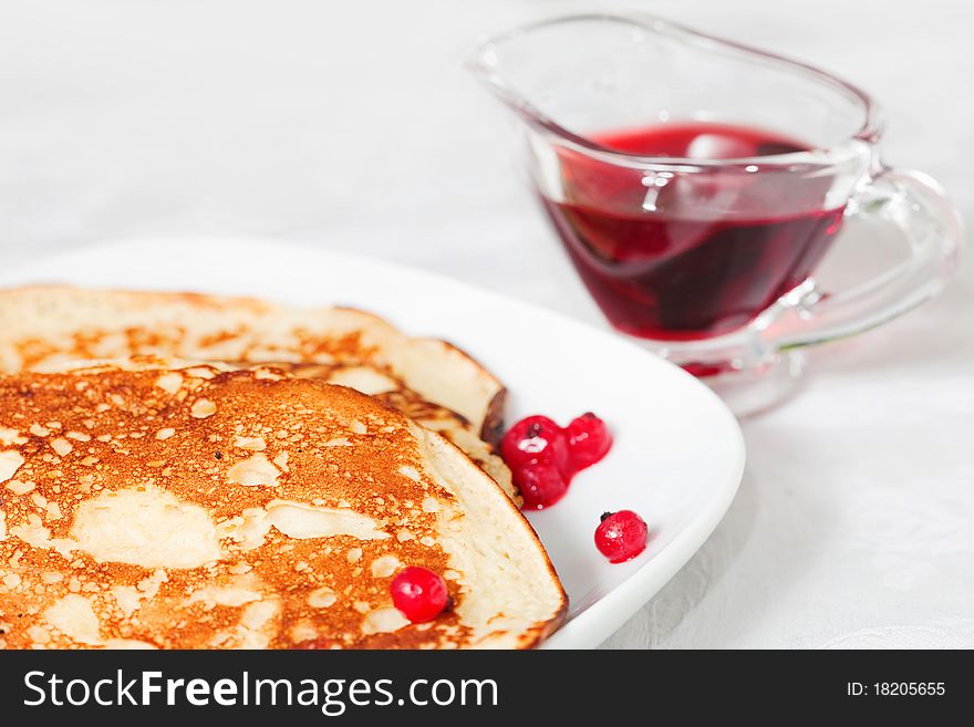 Tasty pancakes with a syrup, a close up