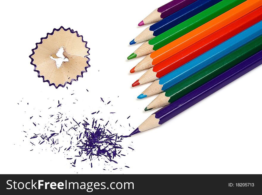 The grinded color pencils are isolated on a white background