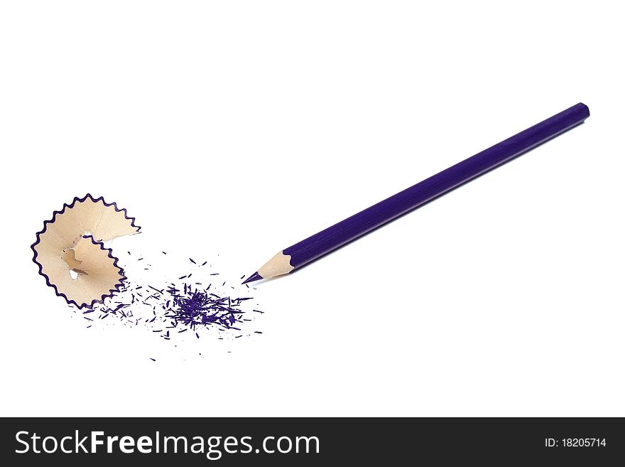 The undermined dark blue pencil and shaving isolated on a white background