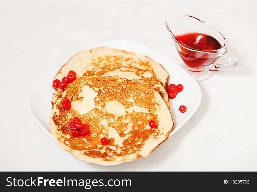 Tasty pancakes with a syrup, a close up