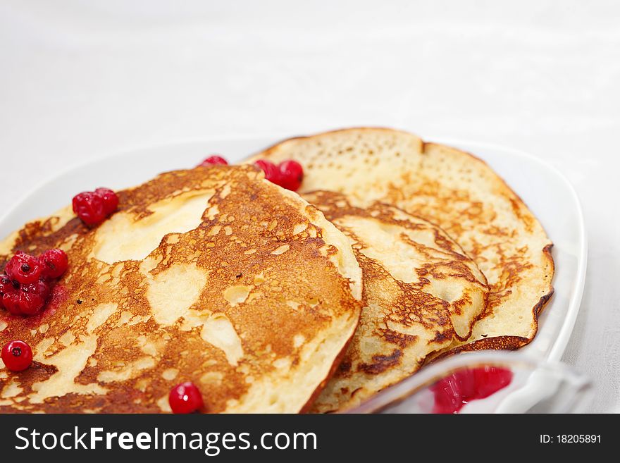 Tasty pancakes with a syrup, a close up