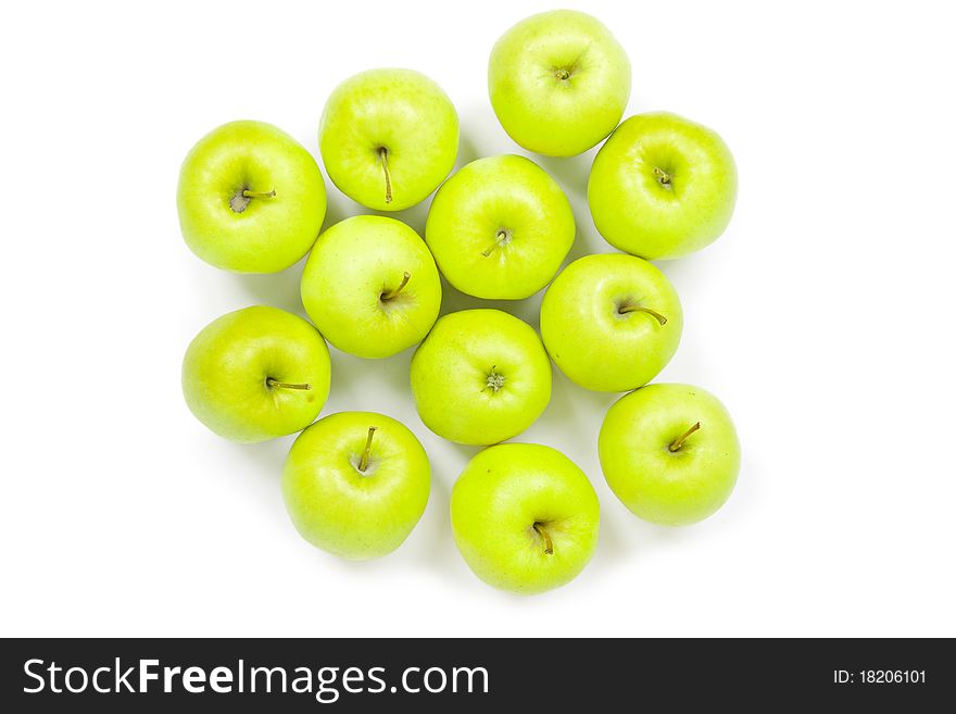 Green and yellow apples on a white baclground isolated