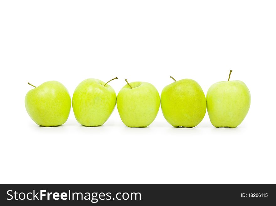 Green and yellow apples on a white baclground isolated