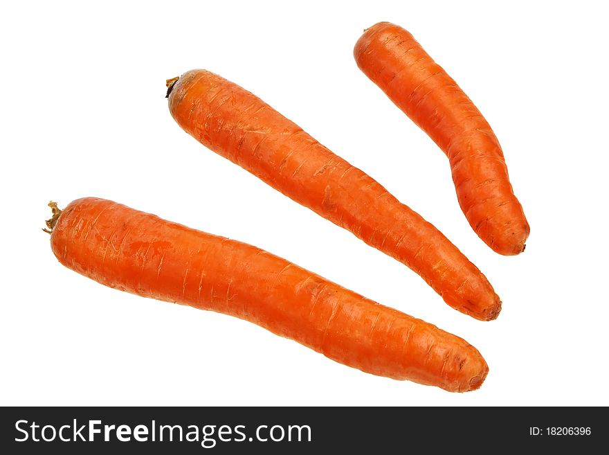 Three ripe carrots isolated over white background. Three ripe carrots isolated over white background.