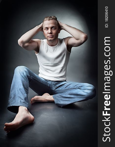 Studio portrait of young guy wearing in jeans. Studio portrait of young guy wearing in jeans