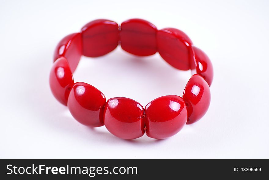 Red stone bracelet over white