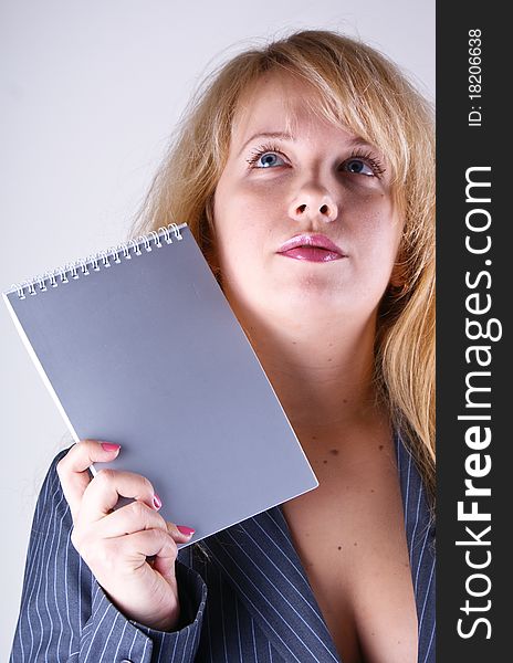 Woman holding grey notebook in hands. Woman holding grey notebook in hands