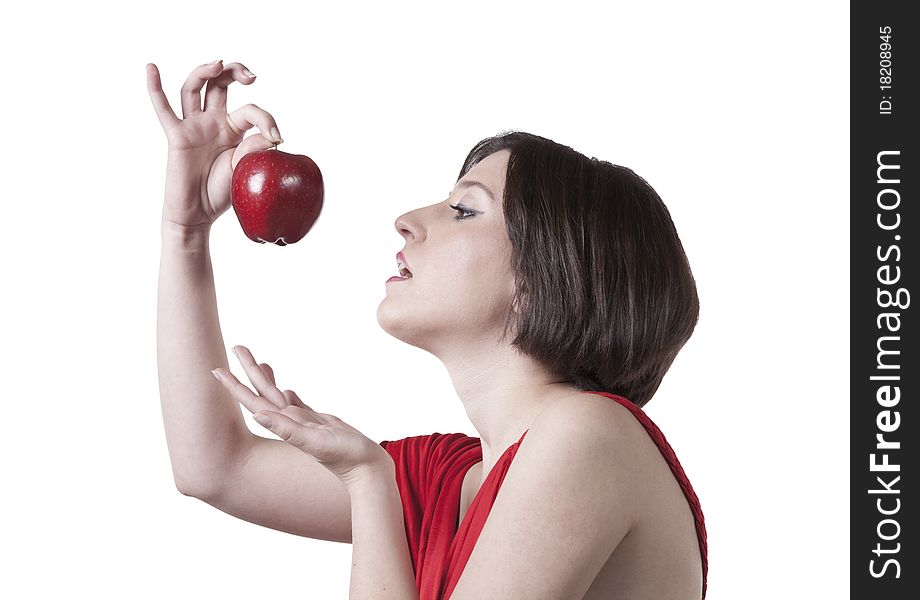 Young girl and an apple red dress on white isolated background. Young girl and an apple red dress on white isolated background