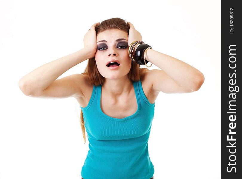 Girl in a dark makeup in blue T-shirt on white background with expression