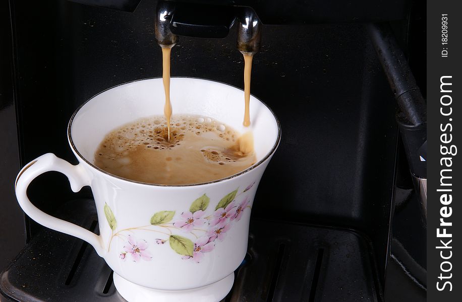 Espresso pouring into a cup, closeup