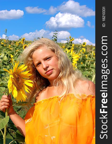 The girl and sunflowers,children and the nature, the girl and flowers, i both sunflowers, people and the nature.